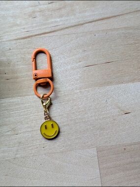 Orange Clip Keychain with Yellow Smiley Charm